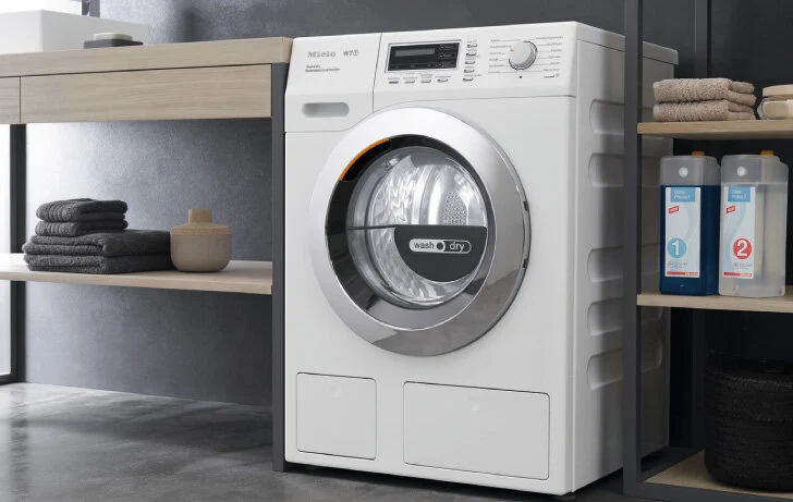 Miele premium front-loading laundry appliance in a modern laundry room